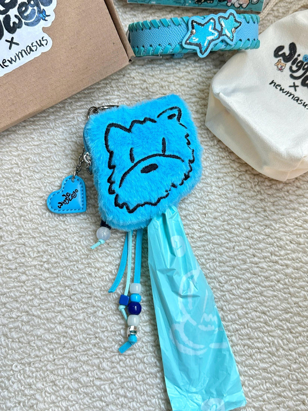 The Plush Poop Bag Holder